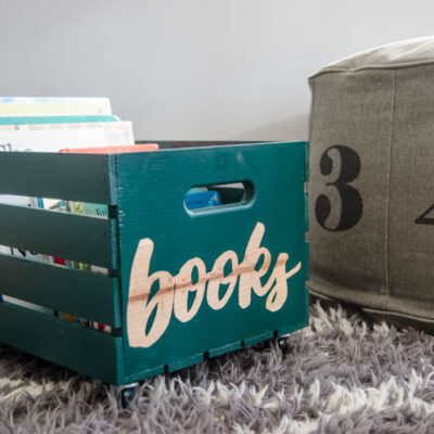 DIY rolling book crate- I love that stencilled label! The natural wood looks so great