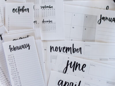 simple hand lettered collection of calendars including list calendars, perpetual calendars, monthly calendars, year at a glance calendar and large format calendars free printable for 2025, shown printed off on a marble countertop with green pen